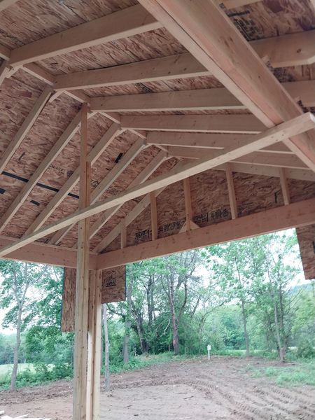 Rafter and ridge framing under a new porch roof