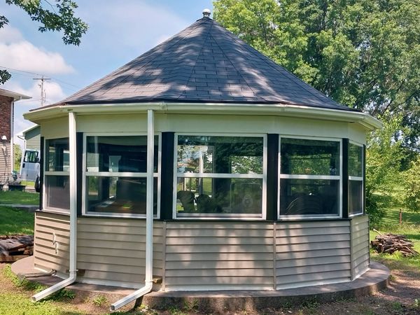 Finished gazebo with new windows, trim, siding and gutters